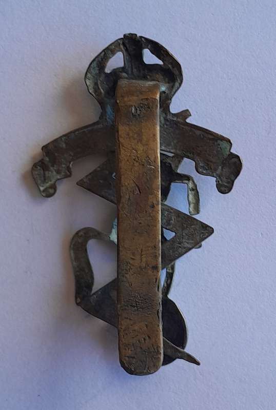 WW2 Royal Electrical Mechanical Engineers Cap Badge.  Slider Intact.