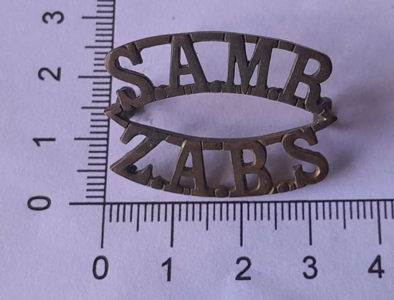 WW1 South African Mounted Rifles Shoulder Title.  Lugs Intact.