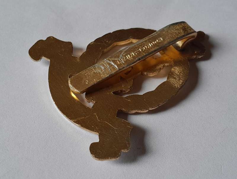 British Adjutant Generals Corps Anodised Aluminium Cap Badge By Firmin.  Slider Intact.