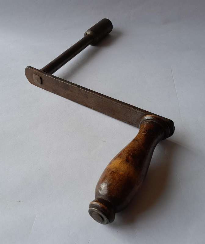 Antique Hand Crank With Turned Wood Handle.