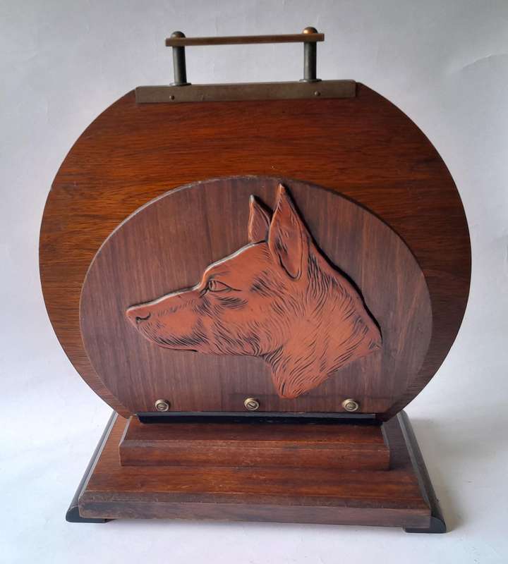 Austrian Art Deco Double-Sided Magazine Holder With Hand-Carved Dog Motifs.