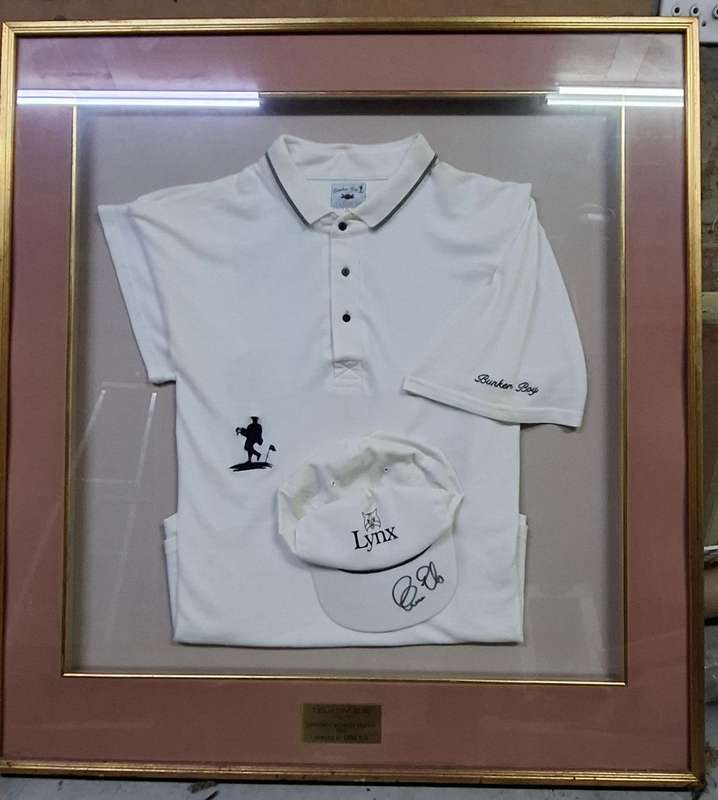 Framed Ernie Els golf shirt and signed cap