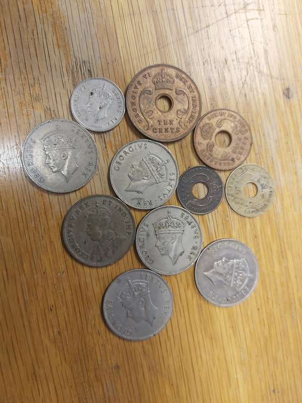 EAST AFRICA COINS (SEE DATES AS PER PHOTO. IT INCLUDES 1922 SILVER 1 SCHILLING)
