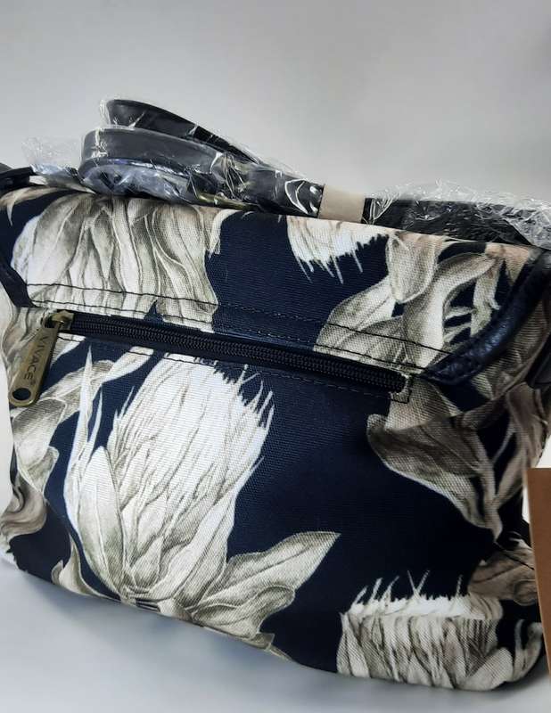 Stunning,Sophisticated And Trendy Shouder Sling Bag BY Vivace ! Black and white Protea design.
