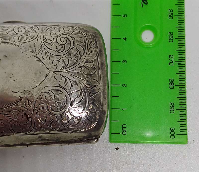 Silver case marked 36g