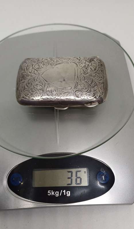 Silver case marked 36g