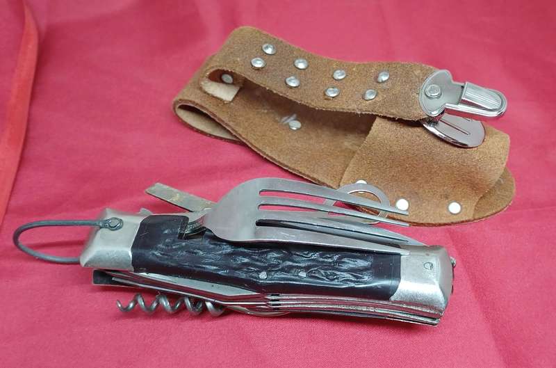 Multi-tool pocket knife in holder