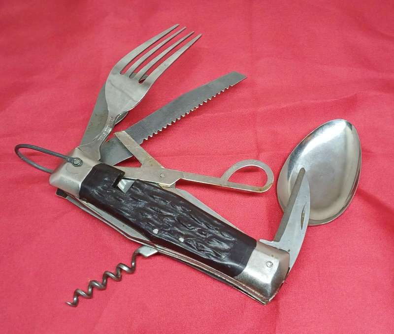 Multi-tool pocket knife in holder
