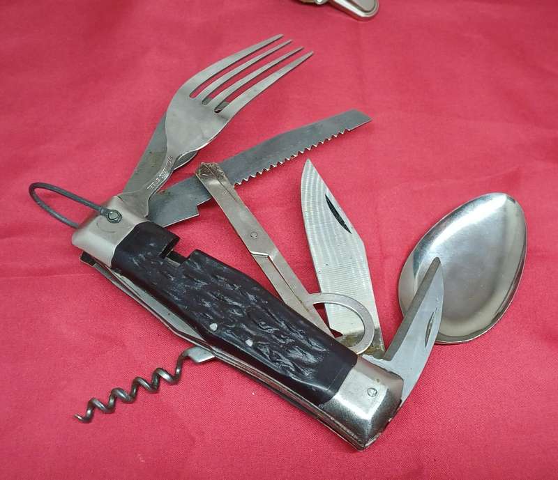 Multi-tool pocket knife in holder