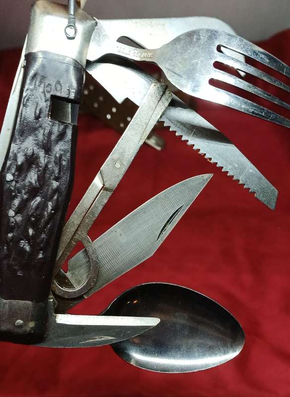 Multi-tool pocket knife in holder