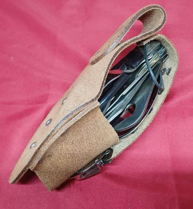 Multi-tool pocket knife in holder