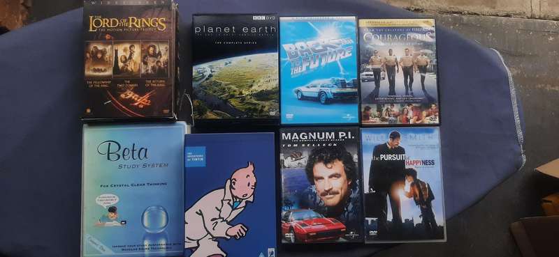 Collection of 8 movie dvd's sets and collectibles.Dispription on pictures