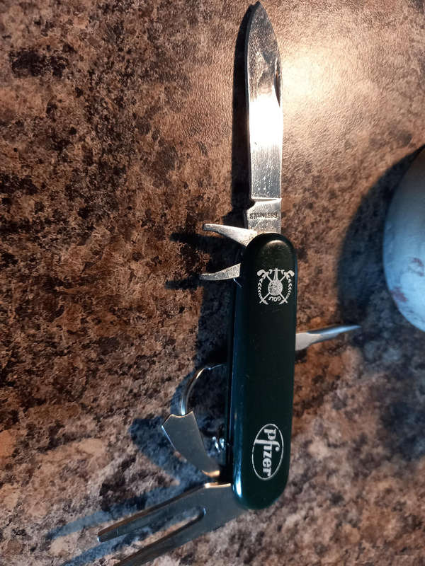 Golf knife and antique lamp