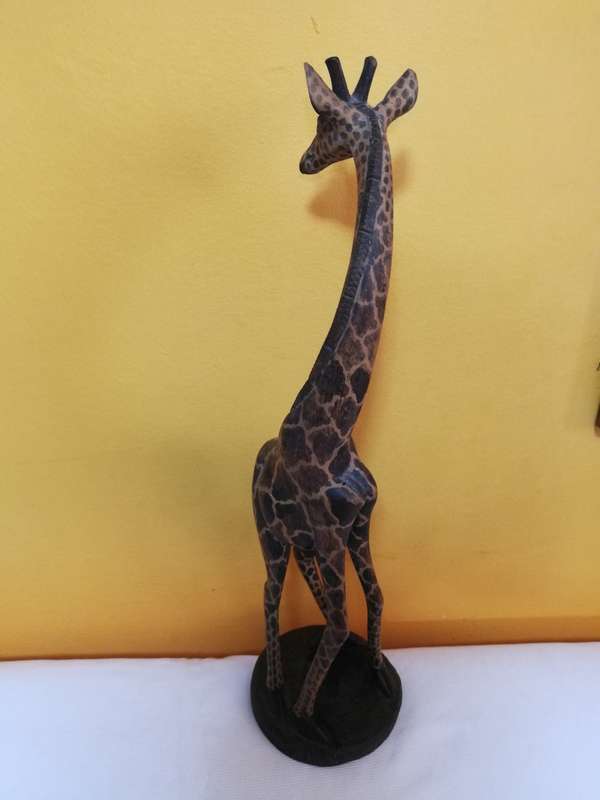 Beautiful handcarved Giraffe from Kenya. Handmade by artisans from a single block of wood.
