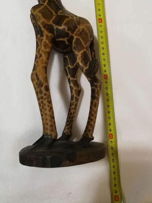 Beautiful handcarved Giraffe from Kenya. Handmade by artisans from a single block of wood.