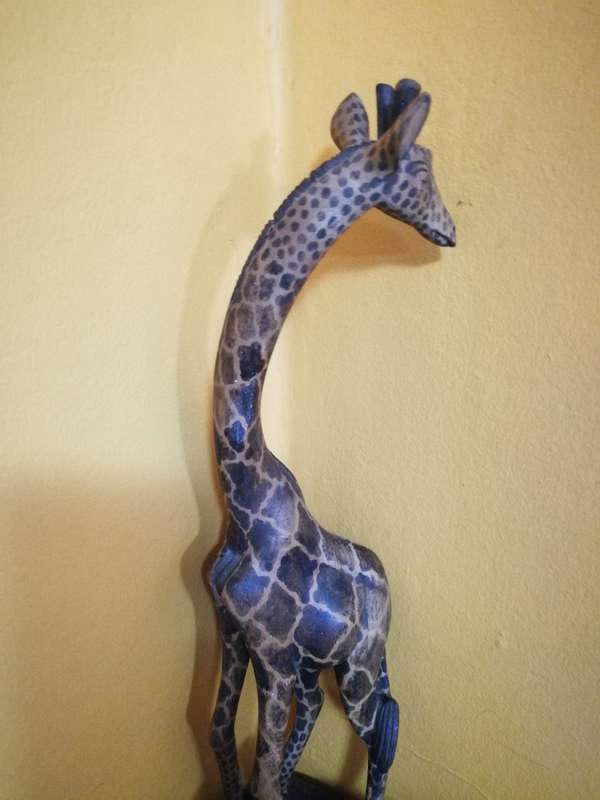 Beautiful handcarved Giraffe from Kenya. Handmade by artisans from a single block of wood.