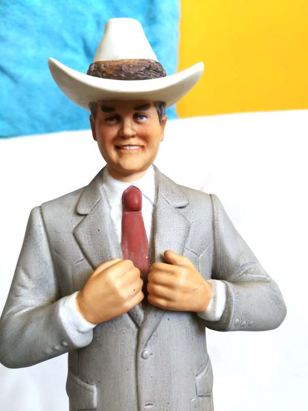 80s Americana Porcelain J.R. Ewing music box/liquor decanter