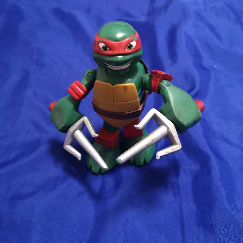 Teenage Mutant Ninja Turtle Action Figure Raphael Moving Arms - VIACOM Intl