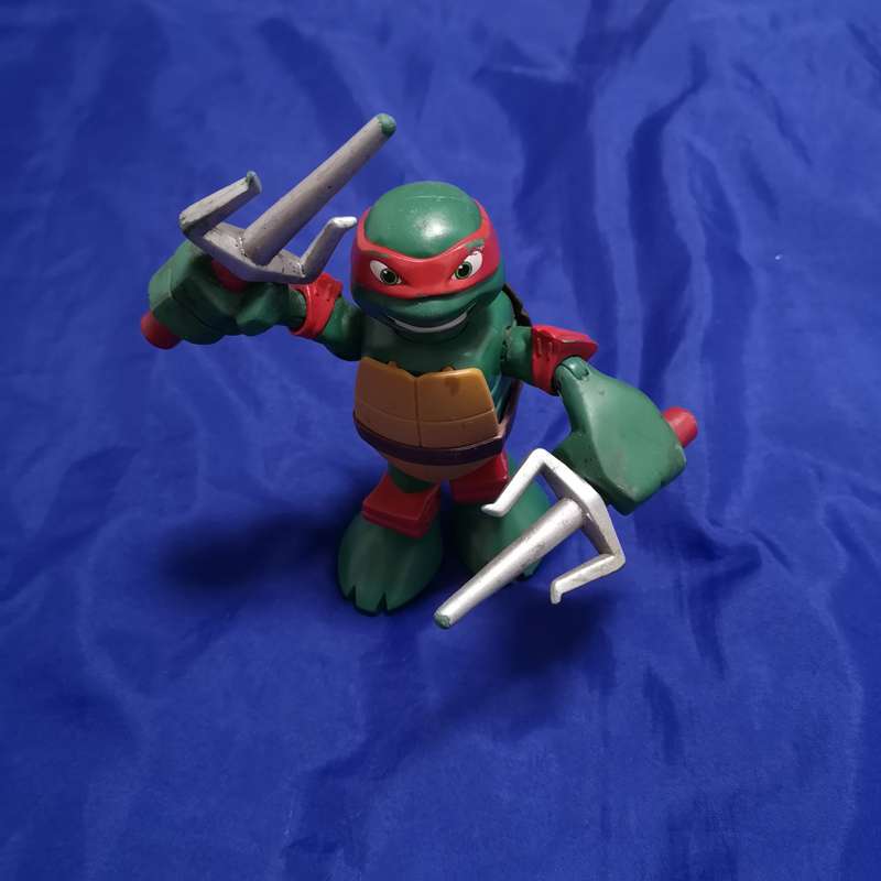 Teenage Mutant Ninja Turtle Action Figure Raphael Moving Arms - VIACOM Intl