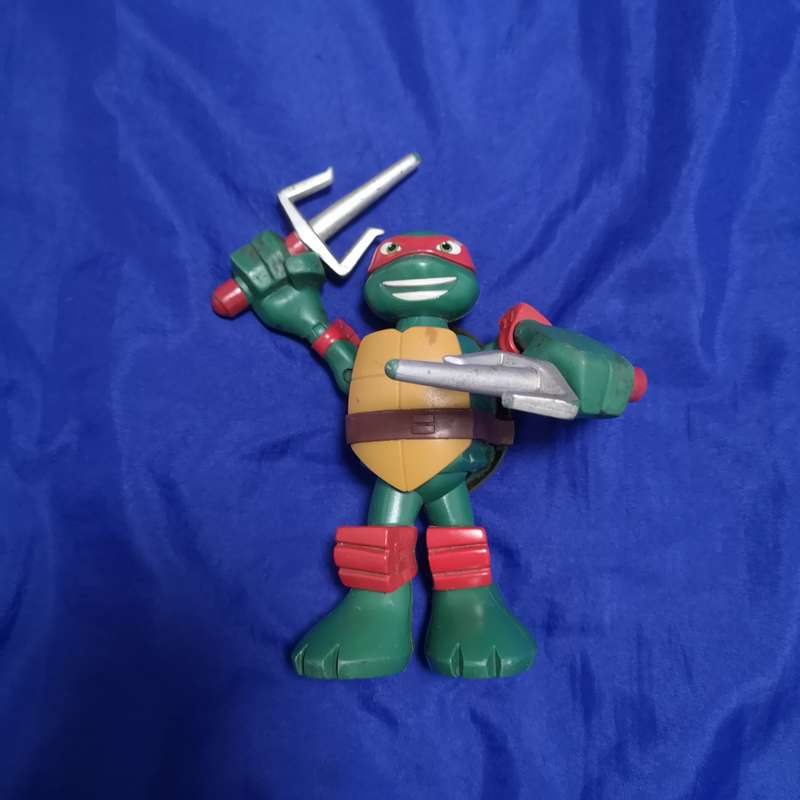 Teenage Mutant Ninja Turtle Action Figure Raphael Moving Arms - VIACOM Intl