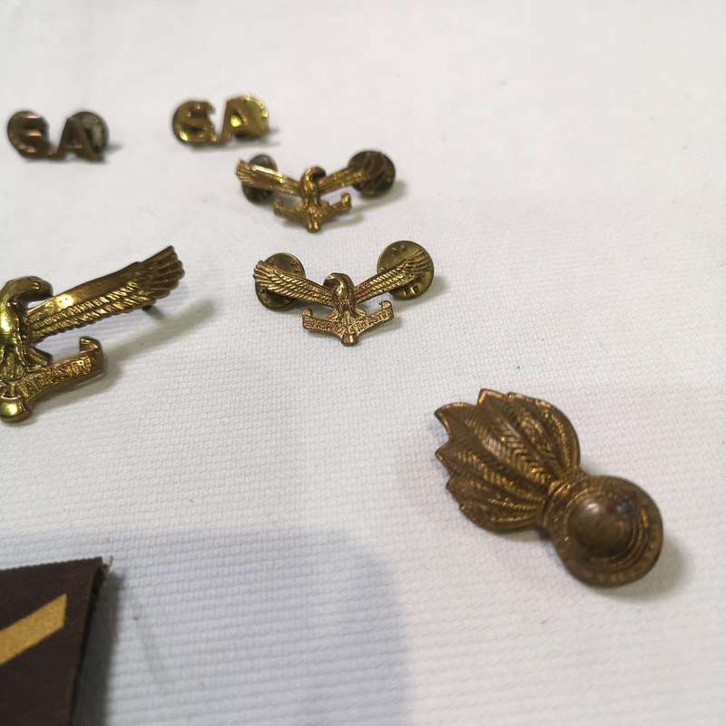 Collection of South African Air Force (SAAF) badges and insignia, primarily featuring cap badges and