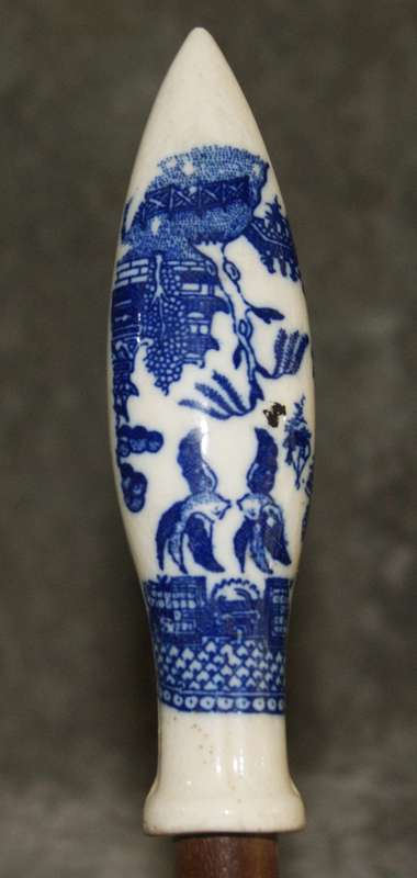 Wooden spoon with willow pattern handle
