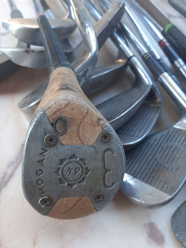 Assorted golf clubs