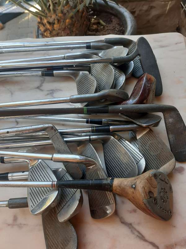 Assorted golf clubs