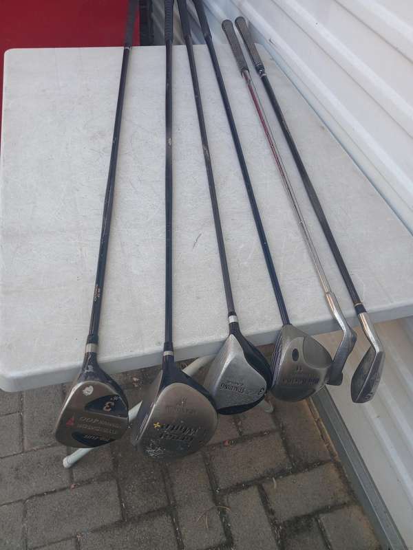 Assorted golf clubs