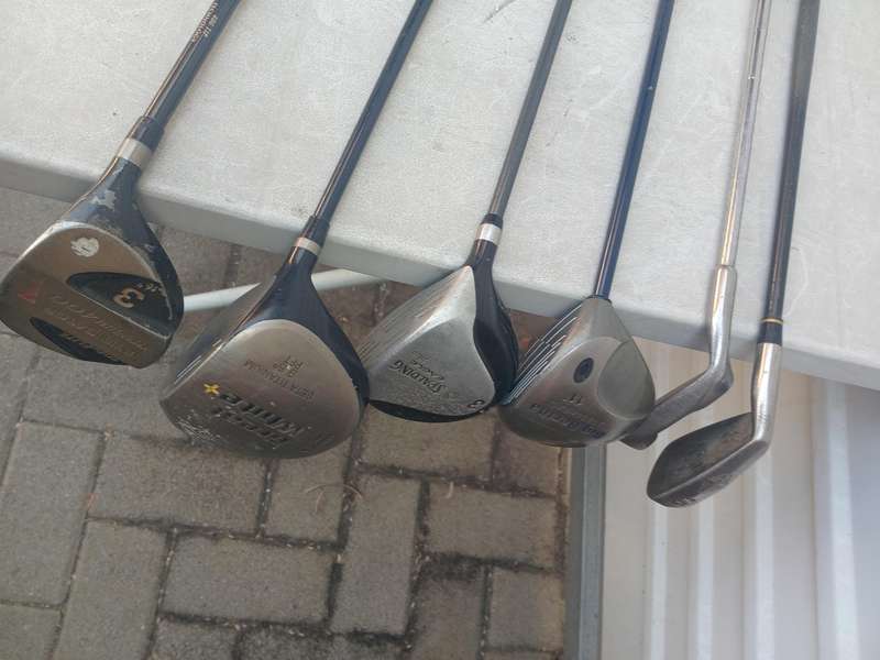 Assorted golf clubs