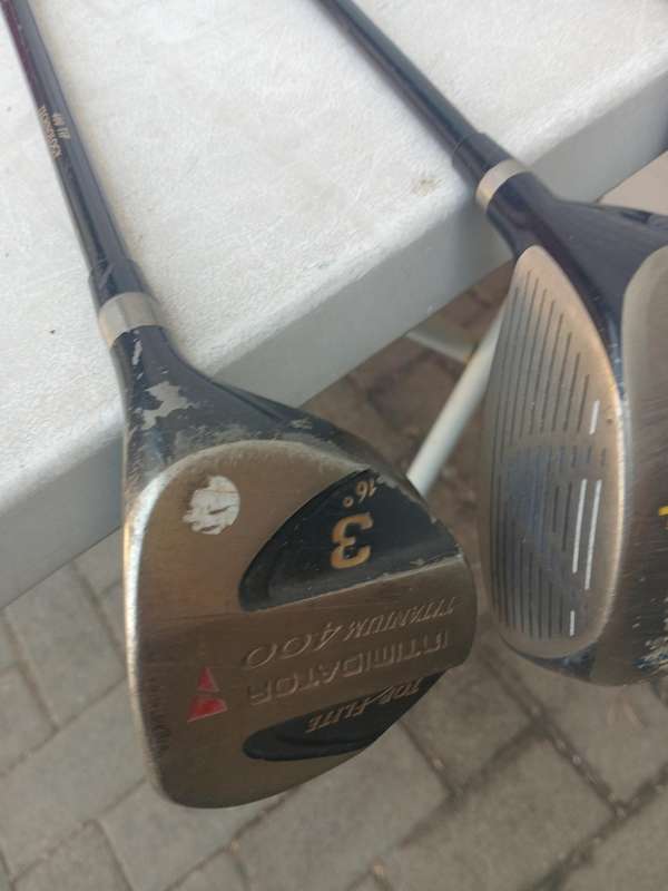 Assorted golf clubs