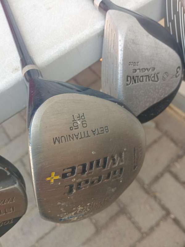Assorted golf clubs