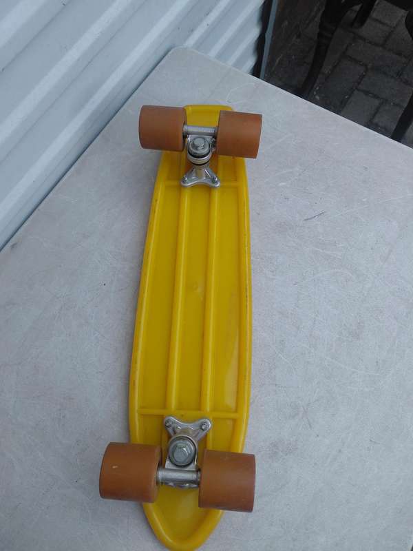1970 yellow plastic skateboard