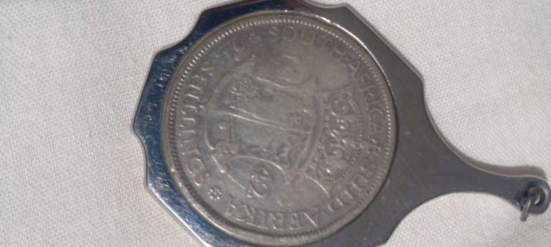 1942  UNION OF SA SILVER HALFCROWN TURNED INTO A PENDANT TOTAL WEIGHT 20.8 GRAMS..