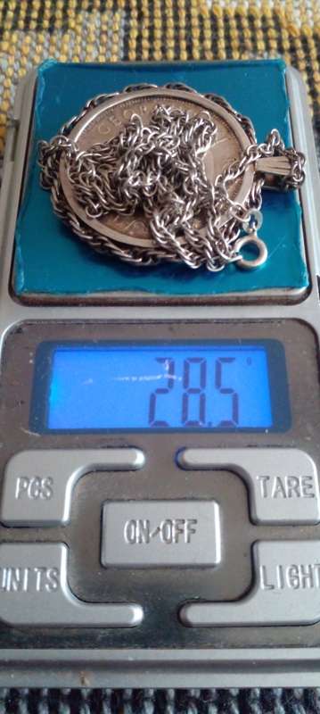 1938 SILVER UNION OF SA HALFCROWN , SET IN A SILVER SETTING AND A  58 CMS LONG SILVER CHAIN.  DESC.