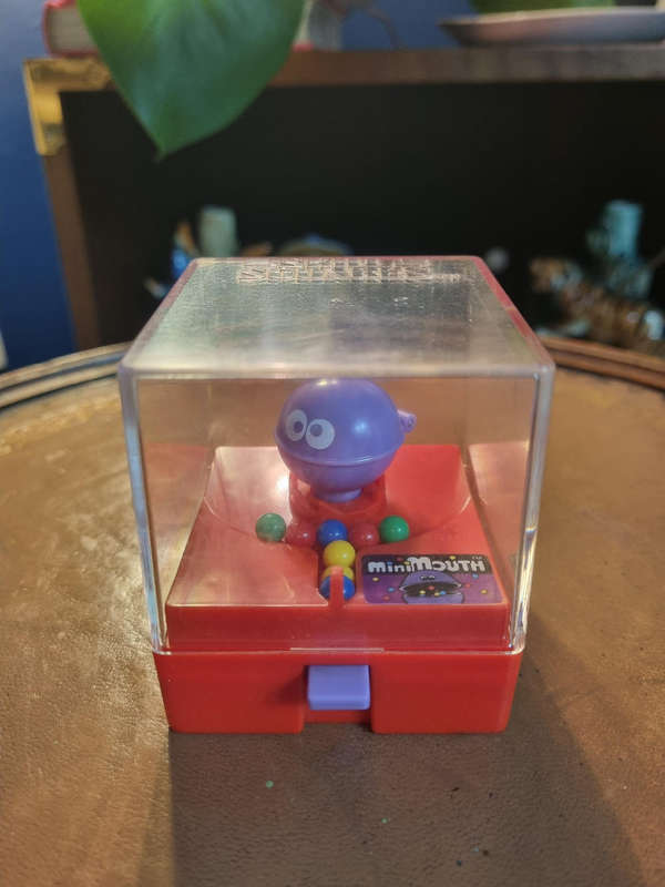 Silver 1980 TOMY Mini Mouth Wind-Up Toy by TOMY