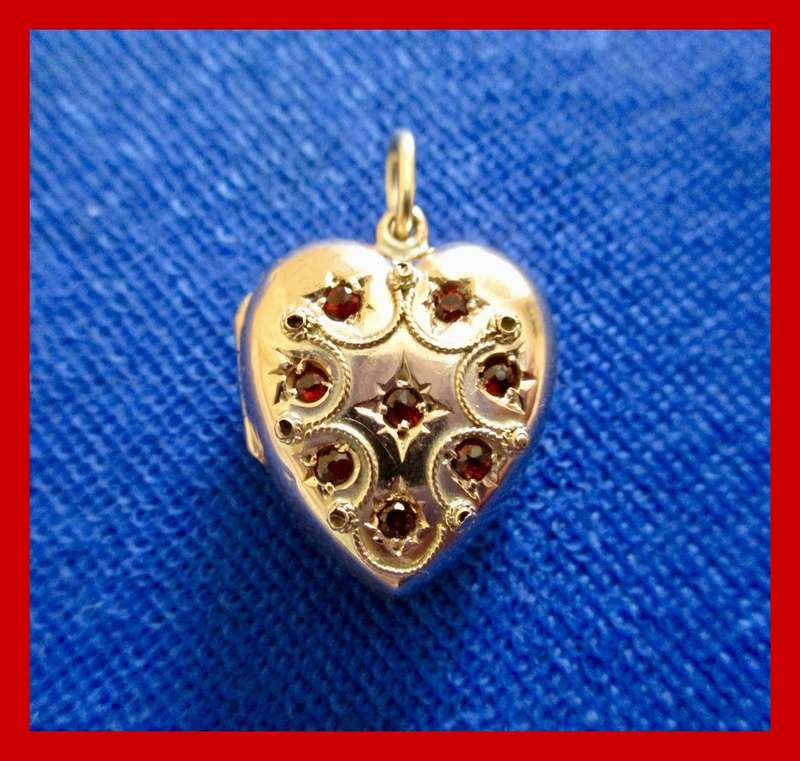 Antique 2.6 grams Nine Carat Gold Opening Heart Locket With Garnets!