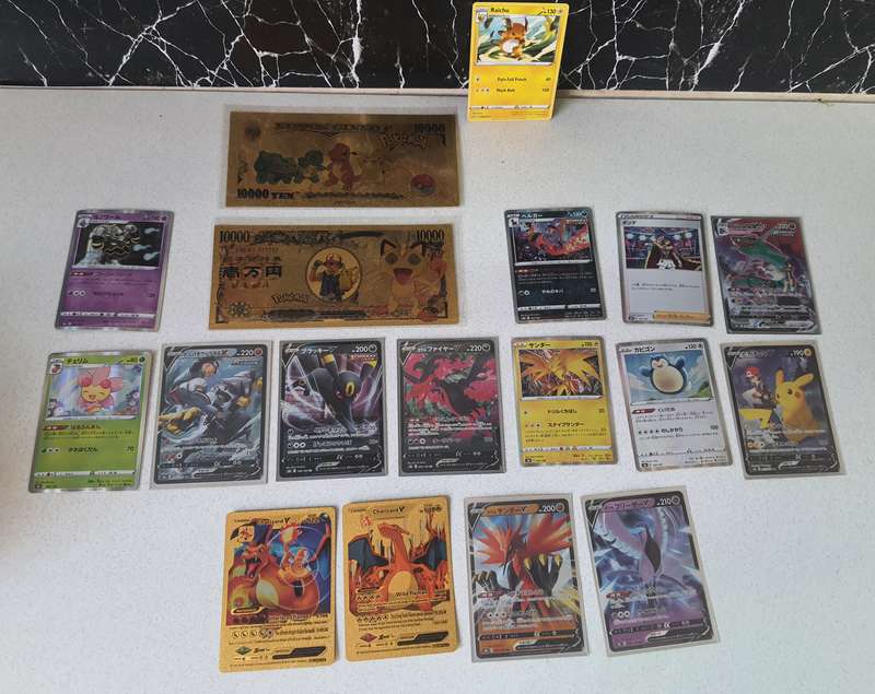 STUNNING COLLECTION OF POKEMON CARDS AND 24CT GOLD FOILD POKEMON NOTES
