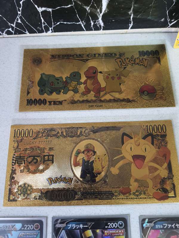 STUNNING COLLECTION OF POKEMON CARDS AND 24CT GOLD FOILD POKEMON NOTES