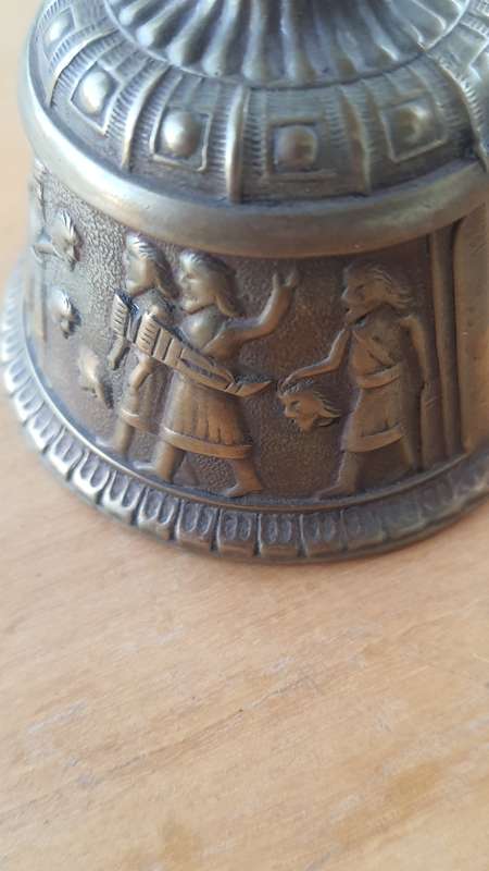 Solid brass bell - depicting the loss of head -Persian maybe???