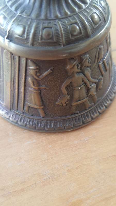 Solid brass bell - depicting the loss of head -Persian maybe???