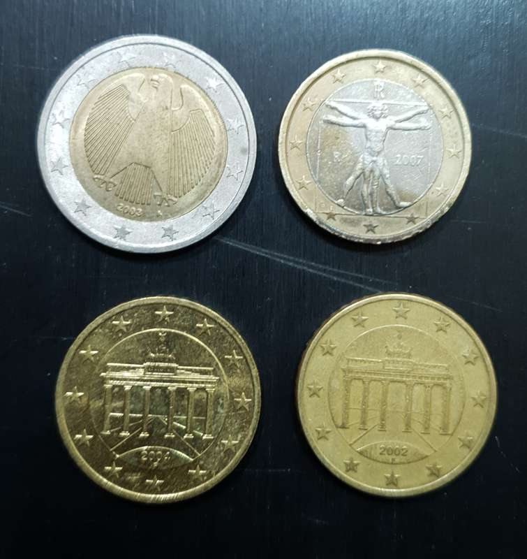 Collection of 4 Euro coins totalling 4 Euro.