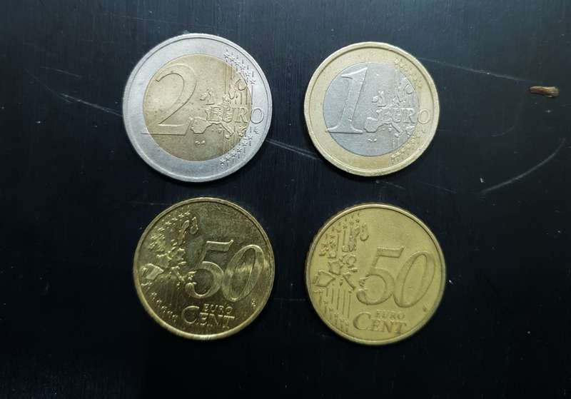 Collection of 4 Euro coins totalling 4 Euro.