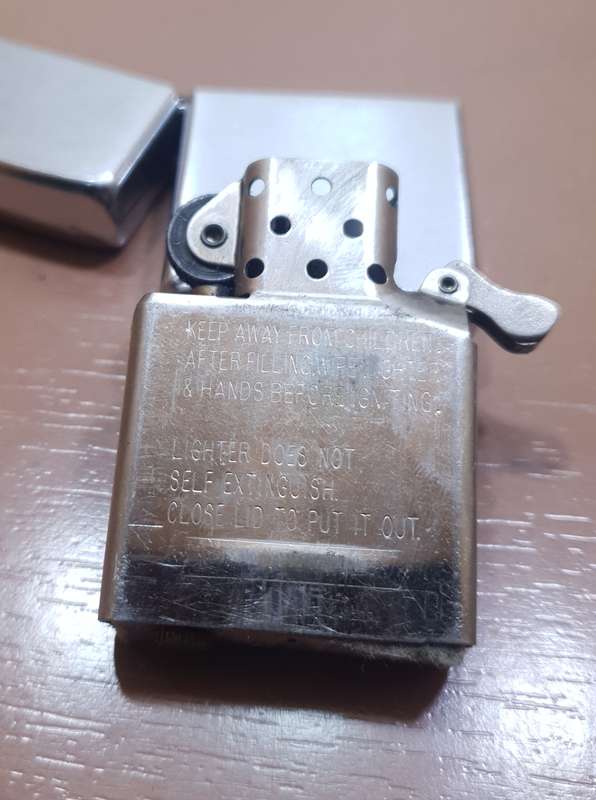 Demo stock - Authentic USA made Classic Brushed Chrome style Zippo Lighter in good condition.