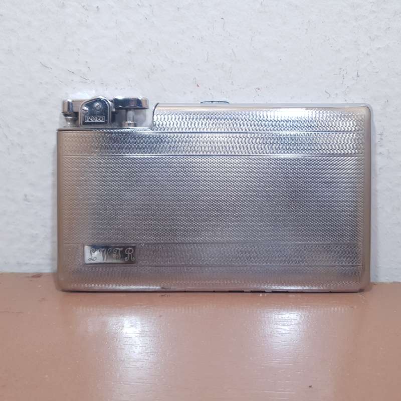 Authentic POLO - England Cigarette case with built in Automatic lighter set circa 1930 like new.