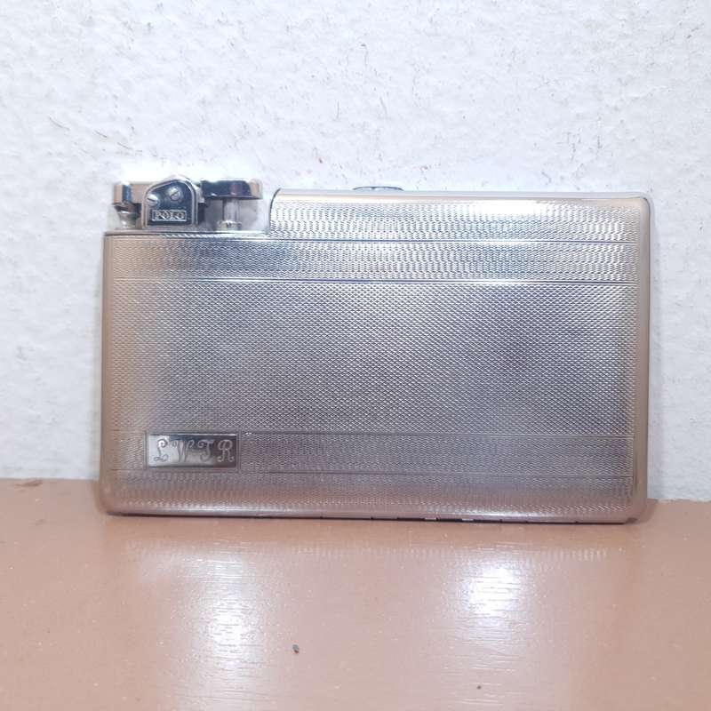 Authentic POLO - England Cigarette case with built in Automatic lighter set circa 1930 like new.