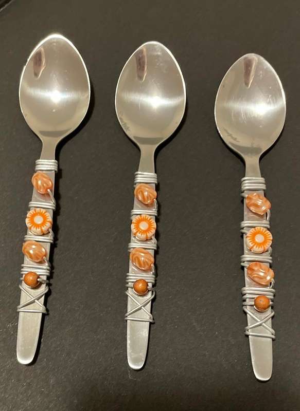 THREE BEAUTIFULLY DECORATED TEASPOONS - STAINLESS STEEL - CORAL COLOURS