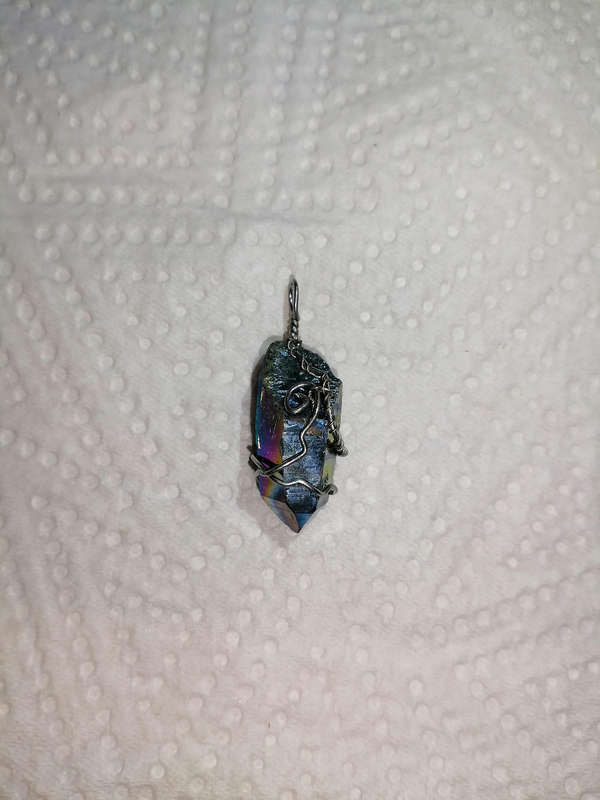 Titanium quartz pendant