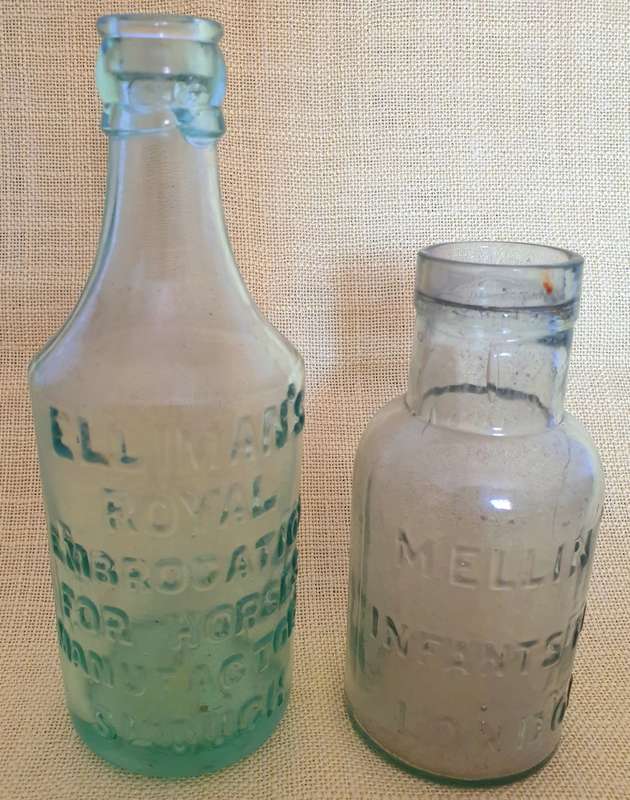 2 x Antique embossed bottles