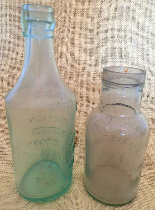 2 x Antique embossed bottles